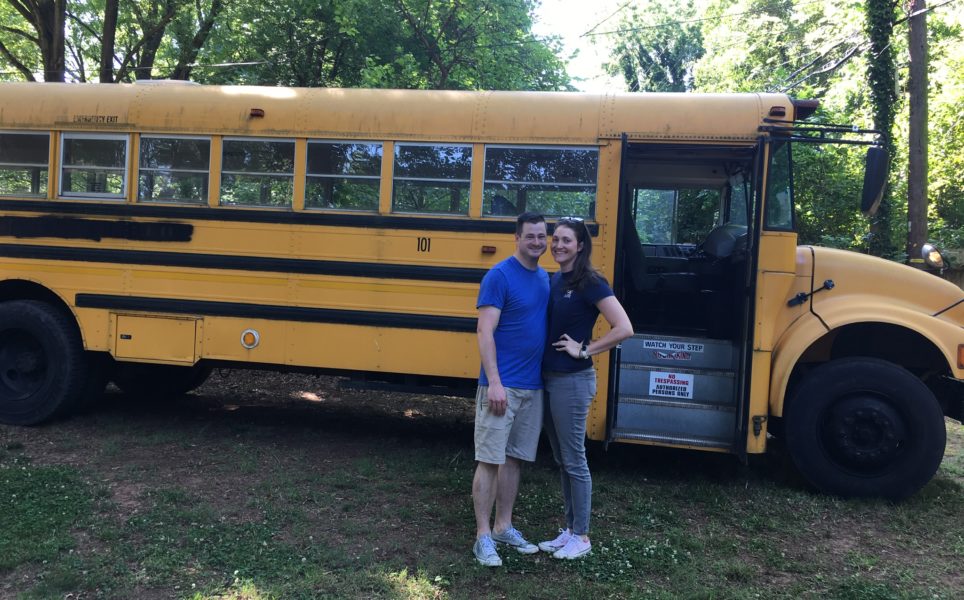 Mark and Chelsea in front of the bus