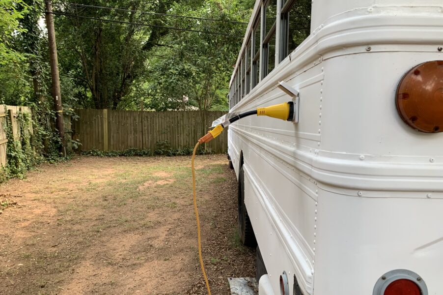 an extension cord running to a 50 amp adapter plugged into our bus