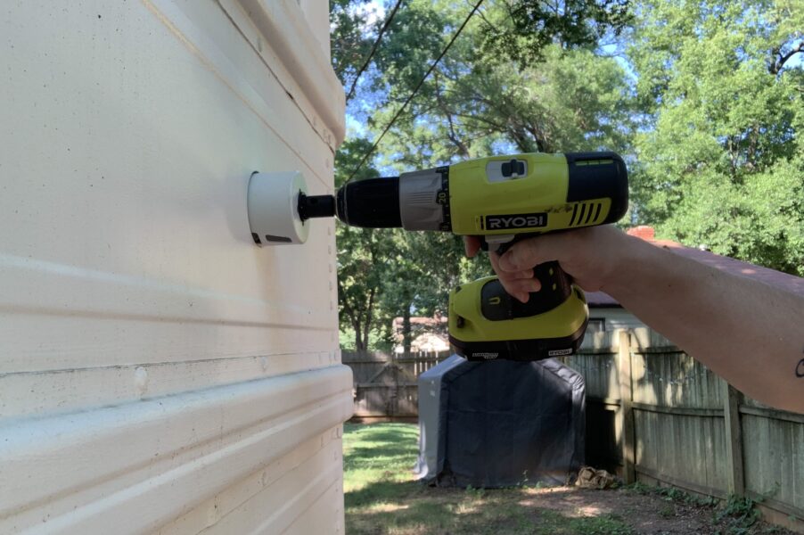 a Ryobi drill with a hole saw in action